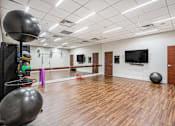Thumbnail 25 of 33 - A gym with exercise equipment at 1600 Glenarm Place, Denver