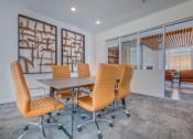 Thumbnail 19 of 34 - a conference room with white walls and a gray carpeted floor
