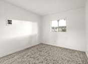 Thumbnail 29 of 36 - A room with a carpeted floor and a window.