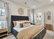 Thumbnail 20 of 37 - A bedroom with a large bed and a ceiling fan