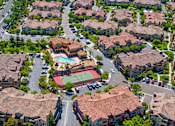 Thumbnail 25 of 29 - A residential area with houses and a pool.