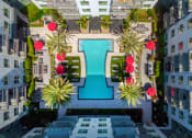 Thumbnail 7 of 48 - a view of a pool from above at Vora Mission Valley with palm trees at VORA LUX, San Diego, 92120