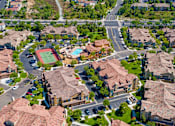 Thumbnail 28 of 29 - A neighborhood with houses and a tennis court.