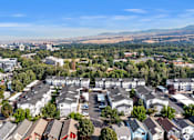 Thumbnail 13 of 46 - A bird's eye view of a residential area with houses and cars.