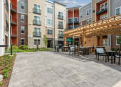 Thumbnail 17 of 24 - our apartments have a large patio with tables and chairs