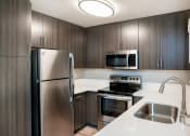 Thumbnail 4 of 28 - 1 Bedroom Unit Kitchen at Central Park, California
