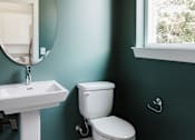 Thumbnail 8 of 18 - A white toilet sits next to a sink in a bathroom.at The Yarra, Tennessee
