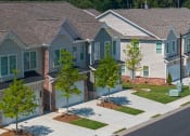 Thumbnail 60 of 60 - a row of houses with trees in front of them