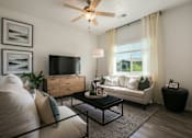 Thumbnail 20 of 38 - an open living room with a couch and a tv