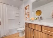 Thumbnail 12 of 34 - a bathroom with a toilet sink and bathtub