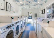 Thumbnail 13 of 21 - Laundry Facility at Softwind Point Apartments
