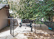 Thumbnail 12 of 46 - A dog park with a sign that says "Logger Creek Dog Park".
