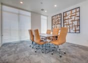 Thumbnail 20 of 34 - a conference room with a table and chairs