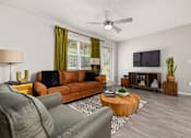 Thumbnail 42 of 48 - Living room with green curtains and leather couch