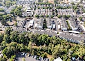 Thumbnail 39 of 46 - A bird's eye view of a residential area with houses and parked cars.