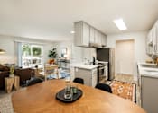 Thumbnail 15 of 48 - Open floor plan with kitchen and living area at Canyon Creek Apartments, Oregon
