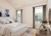 Thumbnail 22 of 60 - a bedroom with white walls and a white bed