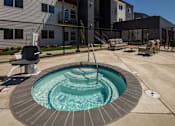 Thumbnail 15 of 27 - Small round pool with a waterfall in the middle at The Arvon, Vancouver, 98662