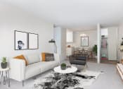 Thumbnail 11 of 25 - a living room with a white couch and a white coffee table