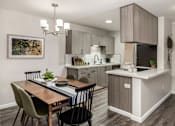 Thumbnail 2 of 48 - Kitchen and dining area with modern finishes at Canyon Creek Apartments, Wilsonville, 97070