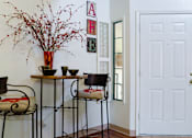 Thumbnail 15 of 51 - a dining room with two chairs and a table and a vase of flowers