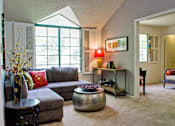 Thumbnail 14 of 51 - a living room with a couch and a table