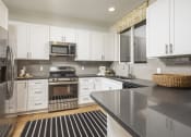Thumbnail 4 of 20 - kitchen with cabinets  at Sorano Apartments