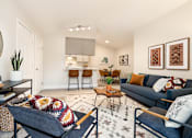 Thumbnail 23 of 48 - Contemporary living room with cozy seating and geometric rug at Canyon Creek Apartments, Oregon