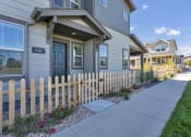 Thumbnail 21 of 51 - a sidewalk in front of a house with a fence