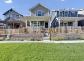 Thumbnail 9 of 51 - a row of houses with a sidewalk in front of them