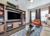Thumbnail 24 of 30 - Model Unit Living Room at Avino in San Diego, CA