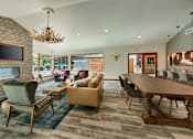 Thumbnail 28 of 48 - Clubhouse dining and lounge area with antler chandelier at Canyon Creek Apartments, Oregon
