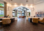 Thumbnail 34 of 48 - A modern office space with wooden floors and a large painting on the wall.
