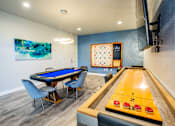 Thumbnail 27 of 44 - A pool table with a blue cloth and a cue ball in the middle of the table.
