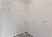 Thumbnail 9 of 36 - Empty white refrigerator with shelves and racks.