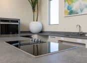 Thumbnail 35 of 59 - a kitchen with a counter top and a sink at Element 12 Apartments, Henderson NV