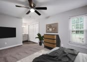 Thumbnail 13 of 22 - a bedroom with a bed and a ceiling fan