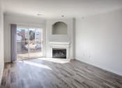Thumbnail 6 of 24 - living room with grey wood style floors, fireplace and balcony