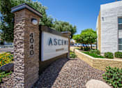 Thumbnail 5 of 18 - A stone pillar with the number 404 on it stands in front of a sign that says "Ascent".