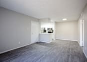 Thumbnail 10 of 18 - A room with a grey floor and a white wall.