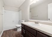 Thumbnail 37 of 48 - Brown Cabinets White counter tops in bathroom