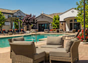 Thumbnail 10 of 38 - Poolside Relaxing Area at SkyStone Apartments, Albuquerque, NM, 87114
