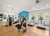 Thumbnail 41 of 48 - Fitness center with cardio and strength equipment at Canyon Creek Apartments, Oregon, 97070