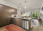 Thumbnail 2 of 30 - a kitchen with wooden cabinets and a large rug on the floorat Allez, Washington, 98052