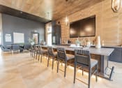 Thumbnail 8 of 24 - a large kitchen with a long table and chairs