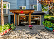 Thumbnail 6 of 33 - Leasing office entrance with covered portico at Hubbard's Crossing Apartments, Kirkland, WA