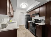Thumbnail 2 of 36 - Model Apartment Kitchen at Central Park East, Washington, 98007