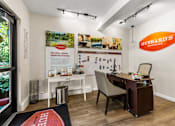Thumbnail 20 of 33 - Leasing office interior with desk and community map at Hubbard's Crossing Apartments, Washington, 98034