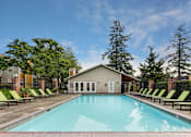 Thumbnail 20 of 30 - A swimming pool with lounge chairs