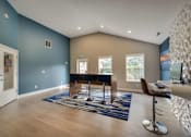 Thumbnail 18 of 30 - A room with a blue wall and a white ceiling.